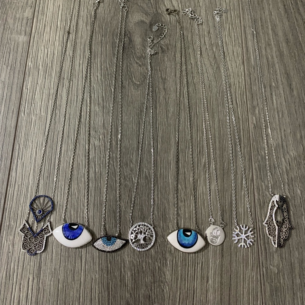 Lot of 8 .925 silver hamsa, evil eye, etc necklaces